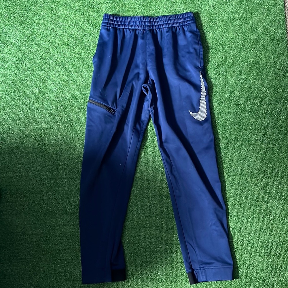 Blue Nike pants boys size large.